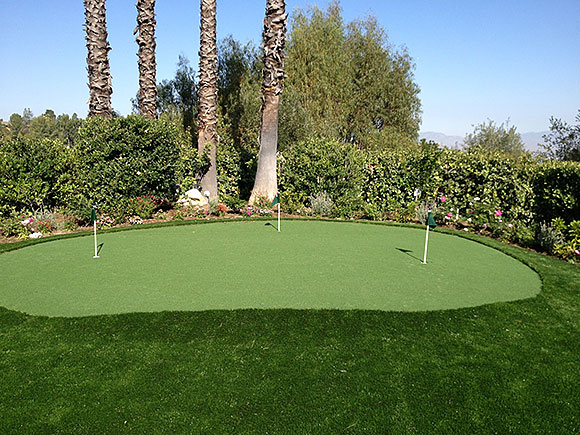 Artificial grass putting green installation